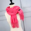 Soft faux cashmere scarf in vibrant rose red with elegant tassel detail for winter. - Watermelon red
