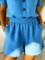 Detailed macro view of blue linen-style elastic waist shorts with side pockets for women - S / Bottoms / Blue