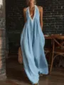Detailed view of light blue lace-trimmed V-neck loose jumpsuit in rustic setting - S / Jumpsuits / Light Blue