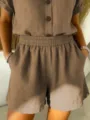 Detailed view of women's brown cotton linen shorts with elastic waist and pockets - Khaki