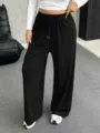 Pantaloni casual neri da donna con coulisse in vita, gamba dritta e vestibilità ampia - Taglia S / Nero