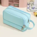 Double-layer light blue canvas pencil case with handle and high-capacity storage design - Blue