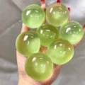 Macro detail view of green translucent squishy stress relief balls held in person's hand - Jade Bead Squishy / 4cm / Green Grape