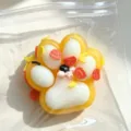 Halloween themed yellow and white cat paw squishy toy with pumpkin and moon decorations - Halloween Pumpkin / Halloween Orange Cat Paw