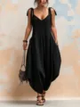 Close-up shot of a stylish black V-neck loose jumpsuit with pockets for summer. - S / Black
