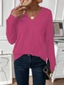 Close-up of a vibrant magenta long sleeve V-neck ribbed knit sweater for women - 1XL / Tops / Pink