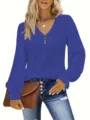 Detail view of the blue eyelet V-neck blouse with button accents and ruffled cuffs. - 0XL / Tops / Blue