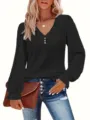Detailed view of women's black V-neck top with eyelet pattern and ruffle cuffs - 0XL / Tops / Black