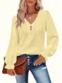 Detailed view of yellow eyelet V-neck top with ruffled lantern sleeves and button trim - 0XL / Tops / Yellow