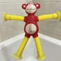 Creative red monkey telescopic tube toy with yellow suction cups for sensory play - Without Lights / Red Yellow Gradient