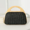 Elegante schwarze Strohhandtasche mit einem natürlichen Holzgriff für modebewusste Damen - Schwarz