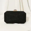 Schwarze Abendtasche mit funkelnden Strasssteinen und goldenem Verschluss für Partys. - Schwarz