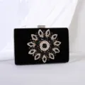 Elegant black velvet evening clutch with a sparkling rhinestone sunflower motif design - Black