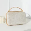 Elegante Abendtasche in Champagner-Glitzer mit einem stilvollen goldenen Metallgriff - Gold