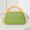 Elegante grüne gewebte Stroh-Abendhandtasche mit einem natürlichen Massivholzgriff - Grün