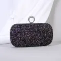 Elegante schwarze Pailletten-Abendtasche mit einem strassbesetzten Ringverschluss. - L / Schwarz