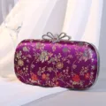 Elegante lila Abendtasche mit Blumenstickerei und Strass-Schmetterlingsverschluss - Lila
