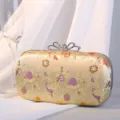 Vintage Abendtasche mit Blumenstickerei und luxuriösem Strass-Schleifenverschluss. - Gold