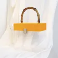 Transparente Acryl-Geschenkbox mit gelbem Veloursdeckel und dekorativem Bambusgriff - Orangegelb