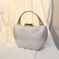 Elegante silberne Strass-Abendtasche mit stilvollem und poliertem goldenem Metallgriff - Silber