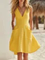 Detailed close-up of a yellow cotton-linen V-neck sleeveless dress with large front pockets - Yellow