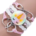 Close-up of a multi-layer unicorn bracelet with pink cord and silver charms - Unicorn Style 1 / 25mm
