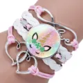 Close-up of unicorn time gem bracelet with braided pink and white straps and Love charm. - Unicorn Style 2 / 25mm