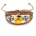 Detailed view of Emoji graduation theme leather bracelet with metal beads - 18mm / Brown