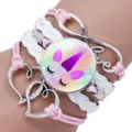 Close-up of multilayer unicorn bracelet with pink ropes and white braided leather cords. - Unicorn Style Six / 25mm
