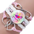 Detailed view of a multi-layer unicorn glass cabochon bracelet with heart charms. - Unicorn Style Seven / 25mm