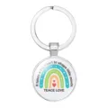 Detail view of a round silver metal teacher keychain with rainbow and heart design - Style 1 (#01) / 25mm Silver