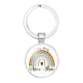 Close-up view of a rainbow metal keychain with 'You Are Never Alone' inspirational text - 25mm White K / #09