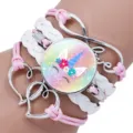 Detail of a multi-layer unicorn bracelet with a pink cord, white braid and heart charms. - Unicorn Style Eight / 25mm
