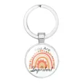 Close-up detail of silver circular keychain featuring a rainbow and You Are Important text - 25mm White K / Crescent Moon Star