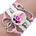 Close-up of pink and white multi-layer bracelet with unicorn charm and love infinity sign. - Unicorn Style Eleven / 25mm