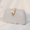 Silver glitter evening clutch bag with an elegant gold leaf-shaped clasp for formal parties - Silver