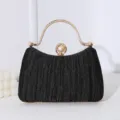 Elegante schwarze plissierte Abendhandtasche mit Perlenverschluss und goldenem Strassgriff - Schwarz