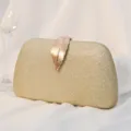 Elegant gold glitter evening clutch bag with a metallic leaf clasp for formal events - Gold