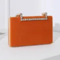 Elegante Abendtasche aus orangefarbenem Samt mit einem luxuriösen Strass-Handgriff - Orange