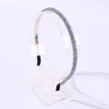 Elegant light blue crystal beaded thin headband displayed on a professional clear acrylic stand - Blue and Champagne