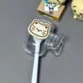 Detail macro view of cute cartoon cat toothbrush protector clip made of clear plastic - DIY Sticker Style / Cat Toothbrush Protector