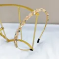 Close-up of handmade peach crystal and rhinestone slim headband for elegant styling - Thin Handmade Beaded Headband / Champagne