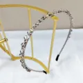 Handmade crystal beaded headband with shimmering rhinestones on a gold display stand - Narrow Handmade Crystal Rhinestone Headband / Gray