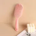 Ergonomic pink hollow detangling massage hairbrush for scalp care and hair styling - Pink
