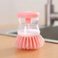 Pink soap dispensing dish brush with transparent liquid reservoir for kitchen cleaning - 9*7 / Pink