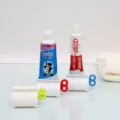 Manual rolling toothpaste squeezer dispenser for efficient bathroom organization - Bag Packaging / Green