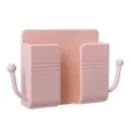 Pink wall-mounted phone charging bracket and remote control storage holder with hooks. - Pink