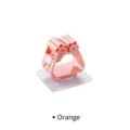 Orange wall-mounted mop holder with roller clip and strong adhesive pad for bathroom - Transparent / Pink Transparent