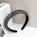 Detailed close-up of a luxury grey rhinestone padded headband with velvet lining - Gunmetal Black Diamond