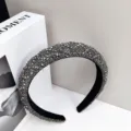 Detail view of high-end elegant grey rhinestone padded headband for party accessories - Transparent Gray Diamond
